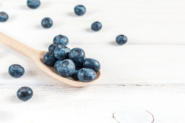 blueberries on wooden spoon