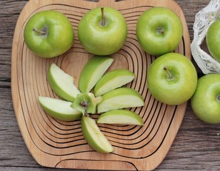 green apples is delicious on wood background.