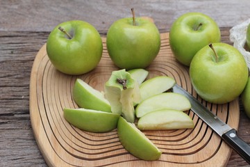 green apples is delicious on wood background.
