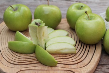 green apples is delicious on wood background.