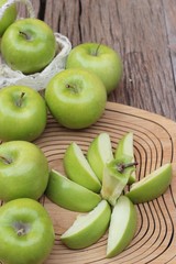 green apples is delicious on wood background.