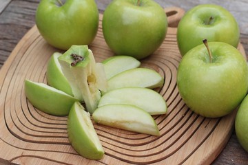 green apples is delicious on wood background.