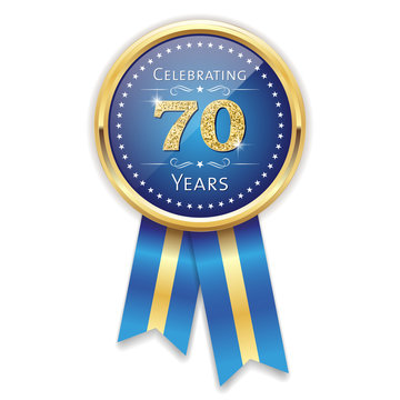 Blue celebrating 70 years badge, rosette with gold border and ribbon
