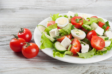 Salad with quail eggs and cherry tomato