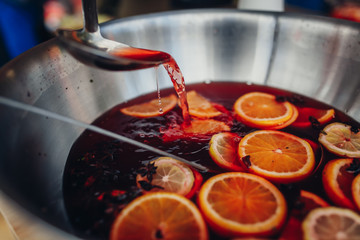 mixed punch with fresh fruits in metal bowl