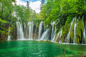     Beautiful landscape, waterfall and clear green water in the Plitvice Lakes National Park in Croatia 