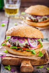 homemade burger with beef cutlet, apple, lettuce, onion and blue cheese