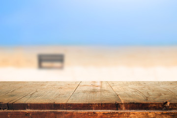 Empty wooden table and blurred beach background,used for display or montage your products,summer