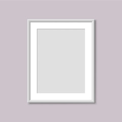Realistic Empty White Picture Frame. Realistic vertical frame for paintings or photographs hanging on the wall