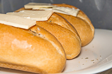 freshly baked white bread French with butter
