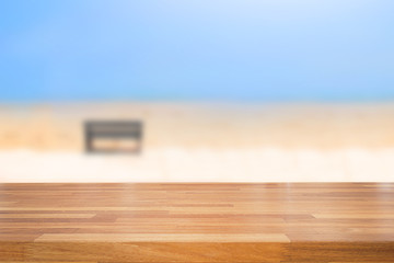 Empty wooden table and blurred beach background,used for display or montage your products,summer