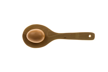 wooden spoon and egg for a minimalist composition