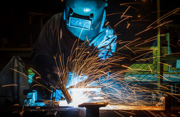 Industrial steel welder in factory