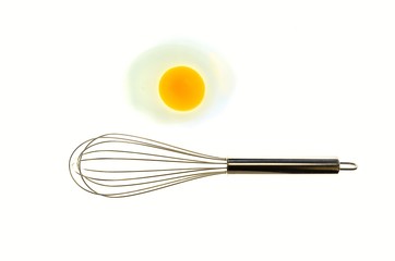 Metal whisk and eggs for a minimalist composition