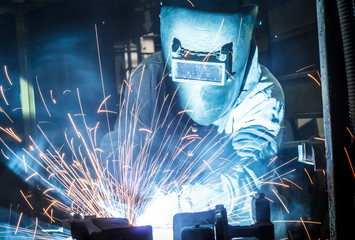 Industrial steel welder in factory - obrazy, fototapety, plakaty