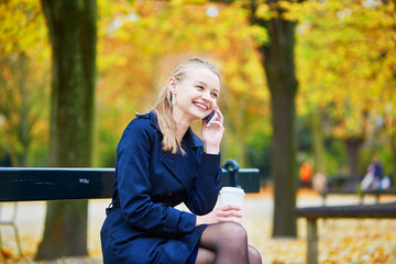 Young woman in the Luxembourg garden of Paris on a fall day