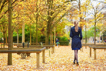 Young woman in the Luxembourg garden of Paris on a fall day