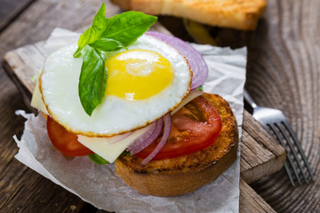 Sandwich with vegetables and fried egg