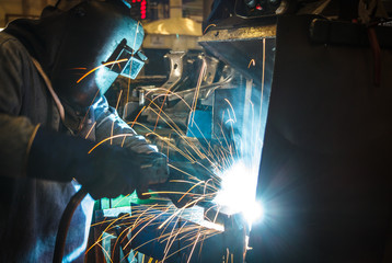 Industrial steel worker speeds motion in factory
