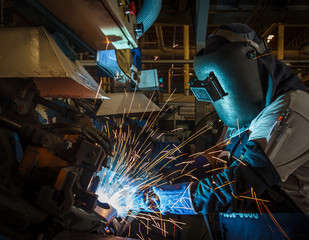 Industrial steel worker speeds motion in factory