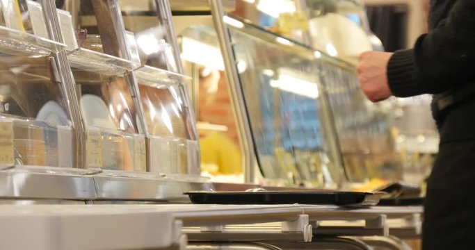 people in the canteen  choose what to eat