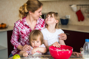 Obraz na płótnie Canvas Girl 7 years preparing breakfast in the kitchen. baby girls, Mom, Kitchen