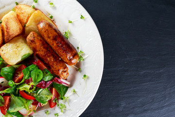 Roasted Sausages with Chips and Mix Vegetable salad