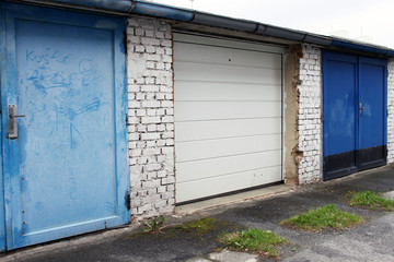 Old versus new, range of garage doors, metal gates