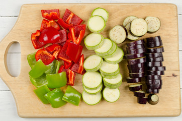 Variously sliced for cooking zucchini, eggplant and paprika on a