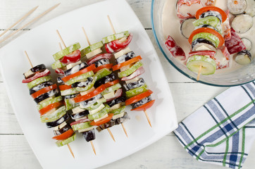 Preparing food for cooking barbecue on skewers