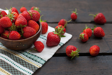 Fresh strawberries on old wooden background