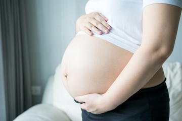 Pregnant woman with ultrasound scan picture