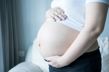 Pregnant woman with ultrasound scan picture