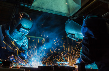 Industrial steel worker speeds motion in factory