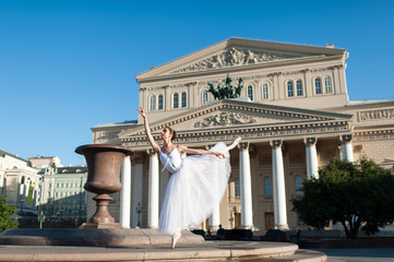 Obraz premium Professional ballerina posing in front of the Bolshoi theater in Moscow