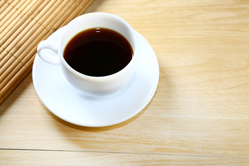 black coffee in white cup on table