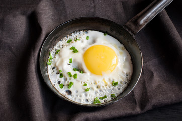 Fried egg in frying pan with bow