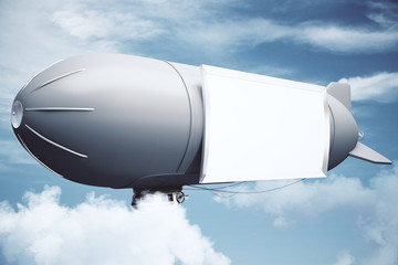 Fototapeta premium Airship in cloudy sky side