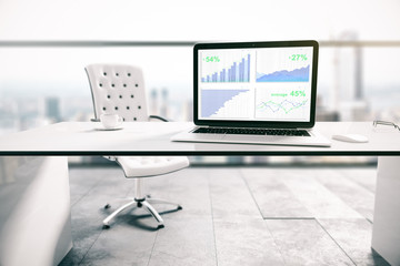 Laptop screen with business charts