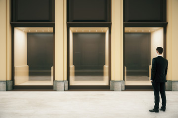 Fototapeta premium Shop exterior and businessman
