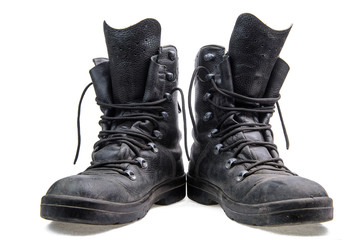 Pair of military boots/Pair of old army boots with untied laces on a white background