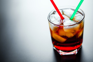 soft drinks. Cola glass with ice cubes on a white background