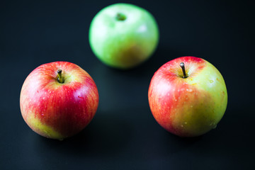 red apple isolated on a black background