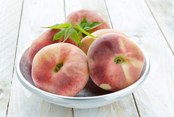 Saturn peaches or UFO, donut, flat peaches on silver plate