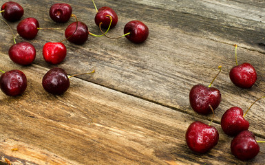 Cherry tails and dew drops on the old boards