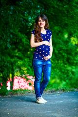 Pregnant woman sitting on a bench