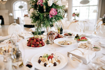 Restaurant table with food. Catering service.  Wedding celebration, decoration. Dinner time, lunch.