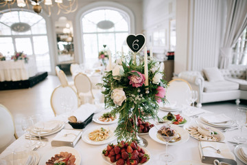 Restaurant table with food. Catering service.  Wedding celebration, decoration. Dinner time, lunch.