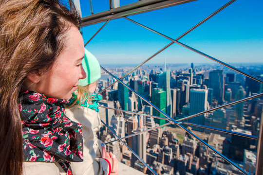 Family Enjoy View To New York City From Empire State Building