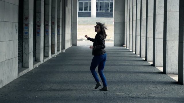 Afraid, scared woman running through city, super slow motion 240fps
